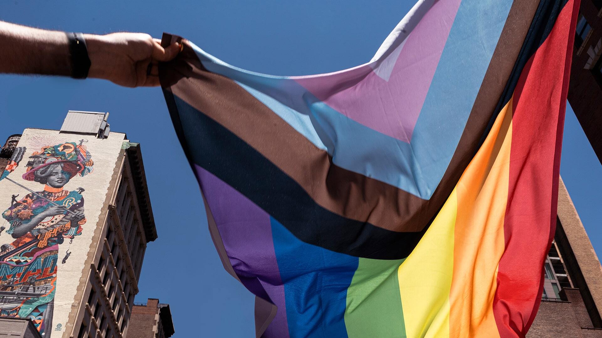 Photo of person holding Pride Flag